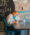 A man wearing glasses is writing on paper in the Click Rain building.