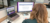 Click Rain Associate Director of Marketing, Bailey Wood, using Google Gemini at her desk.