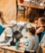 A photo of an office space while three women work at a table