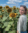 Genna standing in front of a field of sunflowers