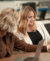 Liv and Chelsea collaborate with laptops at HQ