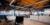 A wide-angel photo of the Click Rain office capturing the open floor plan and coworkers conversing.